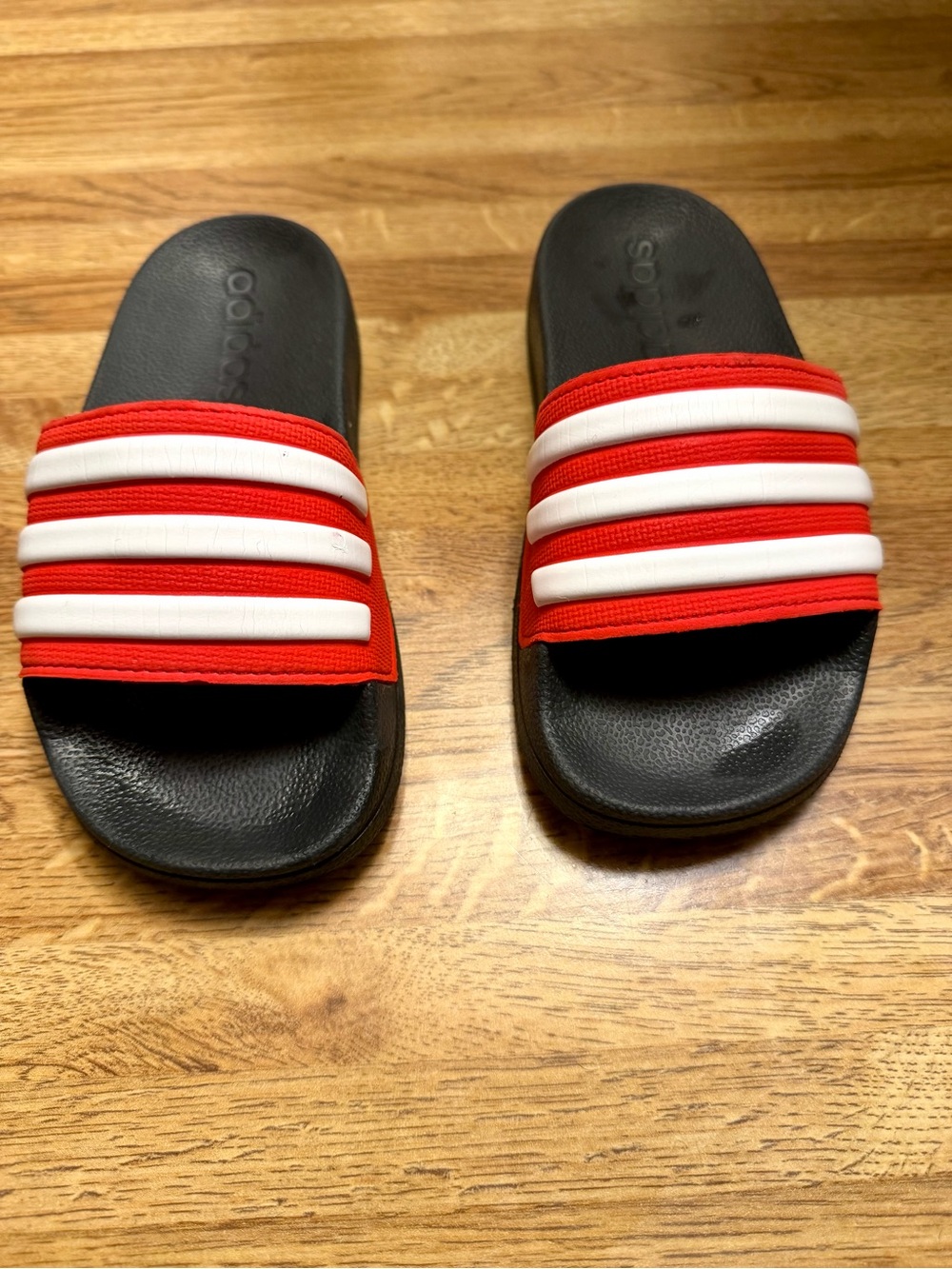 adidas - Kids Red Strap Black Slide Sandals with White Stripes